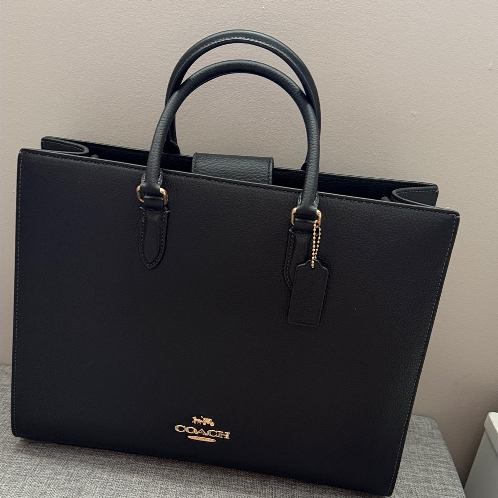Brand new never used Coach Black Leather Handbag with Gold Details